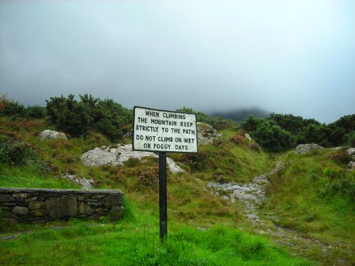 Apparently, this sign assumes that people will only climb the mountain on those days that are neither wet nor foggy. All three of them. You can see just a bit of the mountain there in the background, obscured by the fog. 